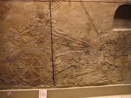 Assyrian carved stone panel, in the British Museum