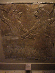 Assyrian carved stone panel, in the British Museum