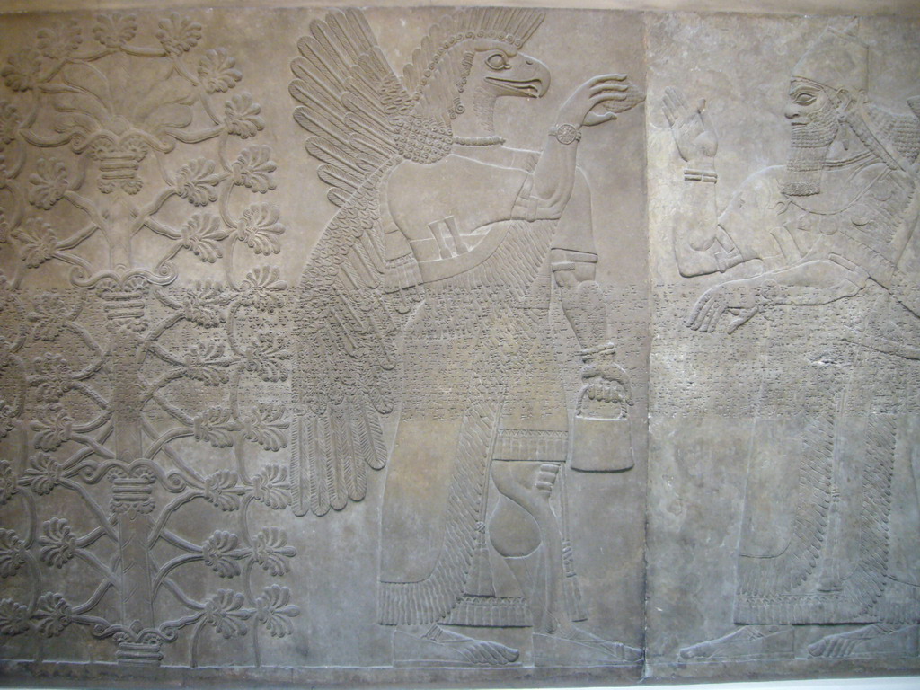 Assyrian carved stone panel, in the British Museum