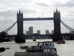 Boats in the Thames river and the Tower Bridge, viewed from the shore on the northeast side of London Bridge
