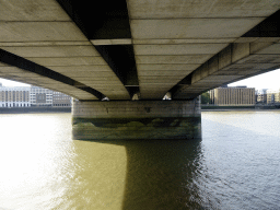 The bottom of London Bridge over the Thames river, viewed from the north side