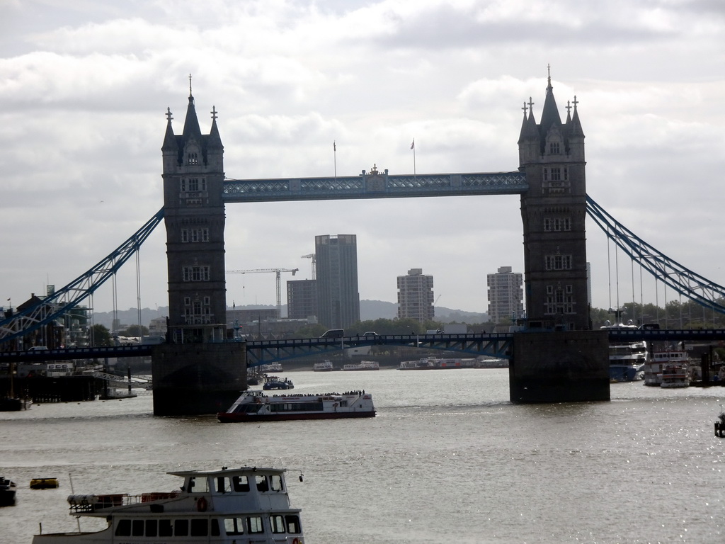 Boats in the Thames river and the Tower Bridge over the Thames river, viewed from the staircase on the northeast side of London Bridge