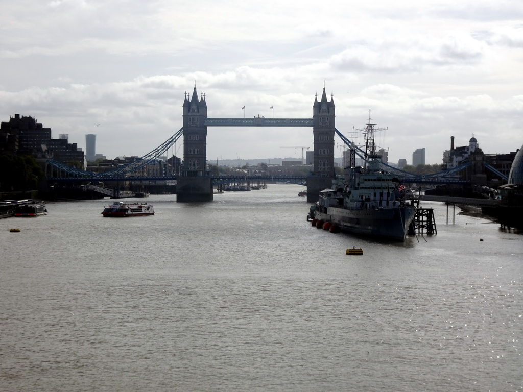 The HMS Belfast and other boats in the Thames river and the Tower Bridge, viewed from London Bridge