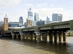 The Cannon Street Railway Bridge over the Thames river, the 22 Bishopsgate building, under construction, the Leadenhall Building, the 30 St. Mary Axe building, the Scalpel building and the Sky Garden building, viewed from the Bankside
