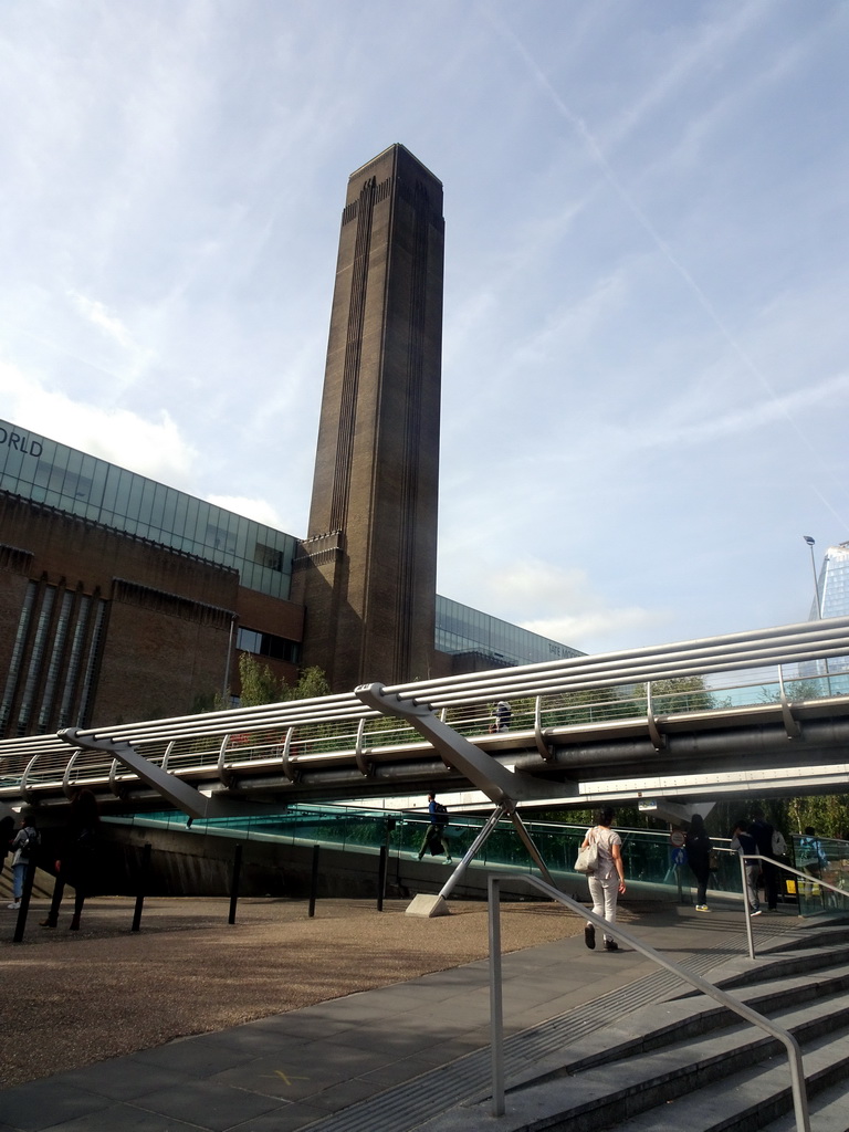 The Millennium Bridge over the Thames river and the front of the Tate Modern museum at the Bankside