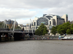 The Hungerford Bridge and Golden Jubilee Bridges over the Thames river and the Charing Cross Railway Station, viewed from the South Bank