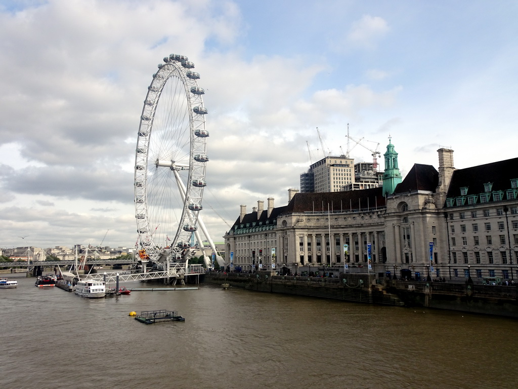 Boats in the Thames river, the Hungerford Bridge and Golden Jubilee Bridges, the London Eye and the County Hall, viewed from the Westminster Bridge