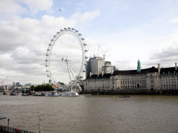 Boats in the Thames river, the Hungerford Bridge and Golden Jubilee Bridges, the London Eye and the County Hall, viewed from the Westminster Bridge