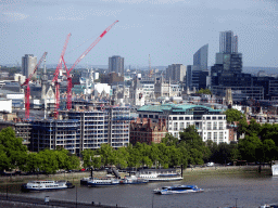 Boats in the Thames river and the Temple area with the Royal Courts of Justice, viewed from capsule 17 of the London Eye