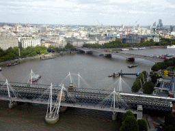 Boats in the Thames river, the Hungerford Bridge, the Golden Jubilee Bridges and the Waterloo Bridge, viewed from capsule 17 of the London Eye