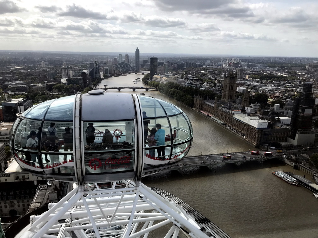 Capsule of the London Eye, boats in the Thames river, the Westminster Bridge, the Palace of Westminster with the Big Ben, the Lambeth Bridge, the Vauxhall Bridge and the St. George Wharf Tower, viewed from capsule 17 of the London Eye