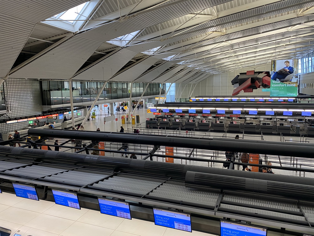Check-in counters at Schiphol Airport, viewed from the walkway to the security check