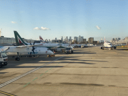 Airplanes at London City Airport and skyscrapers in the city center, viewed from the airplane from Amsterdam