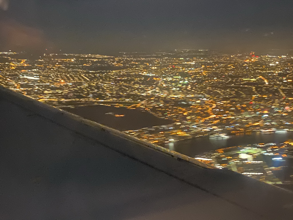 The east side of the city and the Thames river, viewed from the airplane to Amsterdam, by night