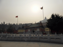 Entrance gate to the Nanshan Temple, with a view on the Nanshan Great Buddha
