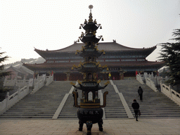 Miaomiao and an incense burner in front of the central hall of the Nanshan Temple