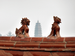 Two gargoyles at the east side of the roof of the Yuantong Hall at the Nanshan Temple, and a pagoda