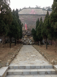 Rock with statue and statuettes at the southwestern side of the central square of the Nanshan Temple