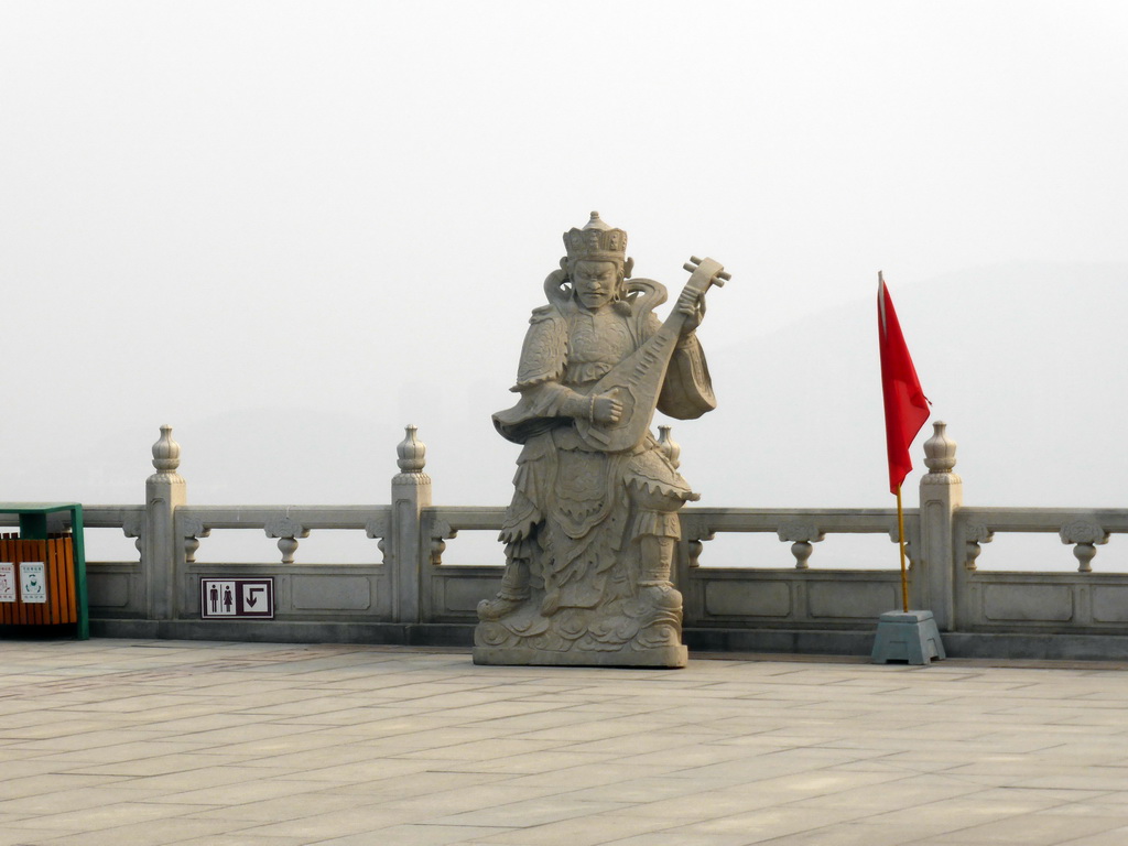 Buddhistic statue at the second highest platform below the Nanshan Great Buddha