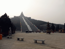 Incense burner at the central square of the Nanshan Temple, and the Nanshan Great Buddha with its staircase