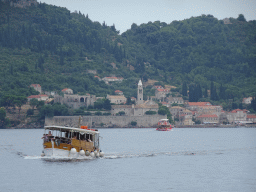 Boats in front of the Lopud Harbour and the Church of Sveta Marija od pilice, viewed from the Elaphiti Islands tour boat