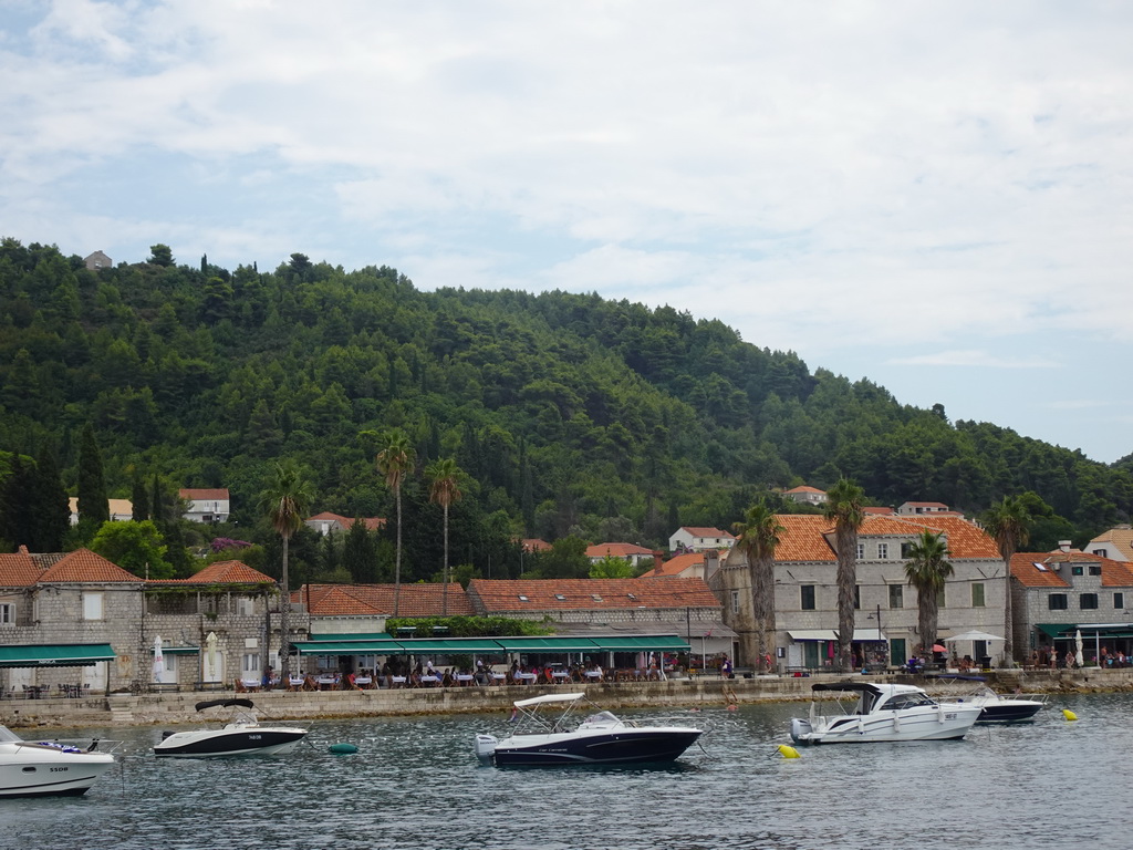 Boats in front of houses at the Obala Iva Kuljevana street, viewed from the Elaphiti Islands tour boat