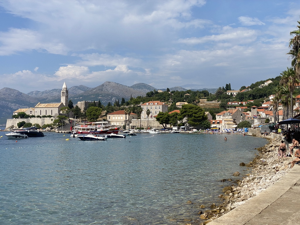 Boats at the Lopud Harbour, the Plaa Dubrava Pracat beach and the Church of Sveta Marija od pilice, viewed from the Obala Iva Kuljevana street