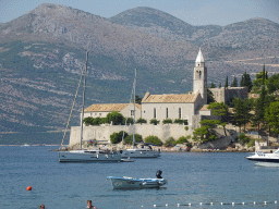 Boats at the Lopud Harbour and the Church of Sveta Marija od pilice, viewed from the Plaa Grand beach