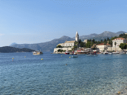 Boats at Lopud Harbour, the Church of Sveta Marija od pilice and Ruda island, viewed from the Obala Iva Kuljevana street