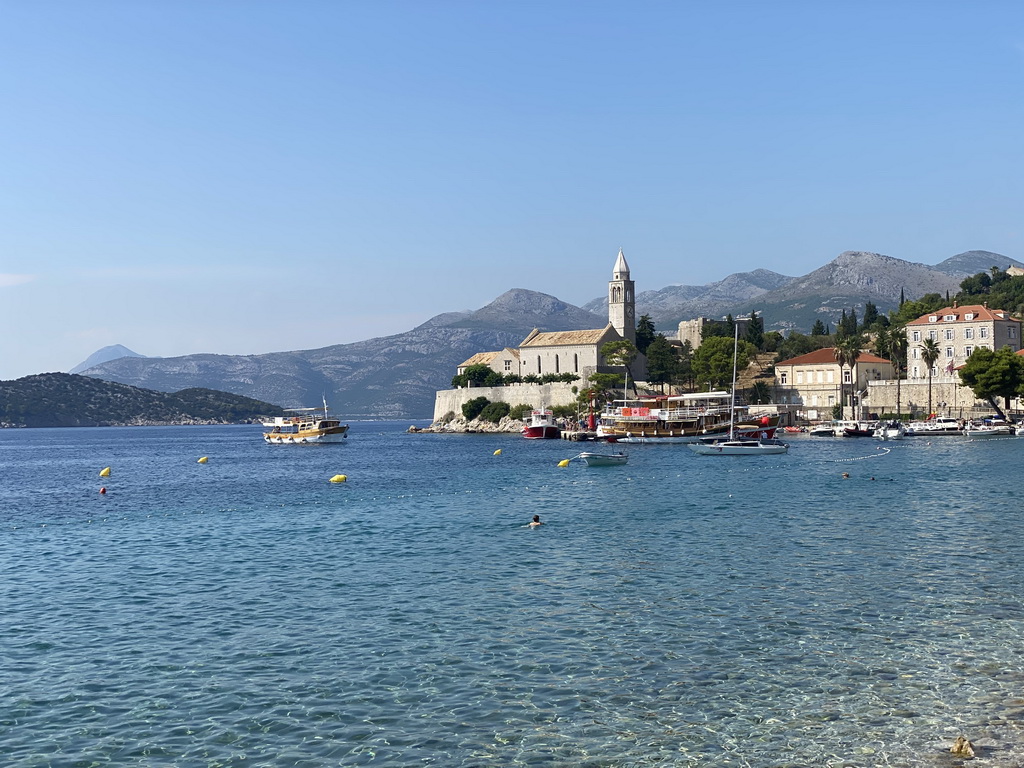 Boats at Lopud Harbour, the Church of Sveta Marija od pilice and Ruda island, viewed from the Obala Iva Kuljevana street