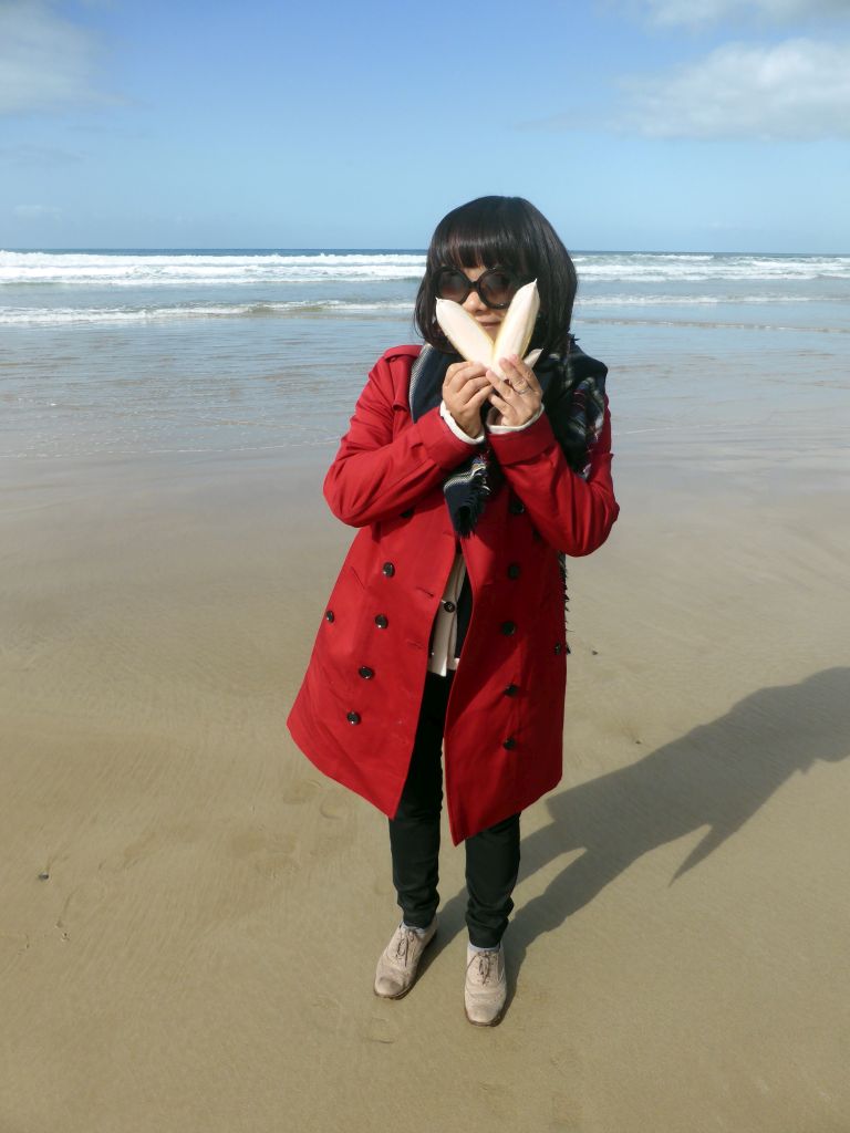 Miaomiao with shells at the beach at Eastern View