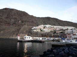 Boats in the Puerto de los Gigantes harbour, viewed from the Calle Poblado Marinero street, at sunset