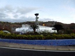 `Pescadora` fountain at the roundabout at the Calle Juan Manuel Capdevielle street, viewed from the rental car, at sunset