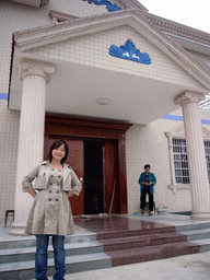 Miaomiao and her grandmother in front of her grandparents` house
