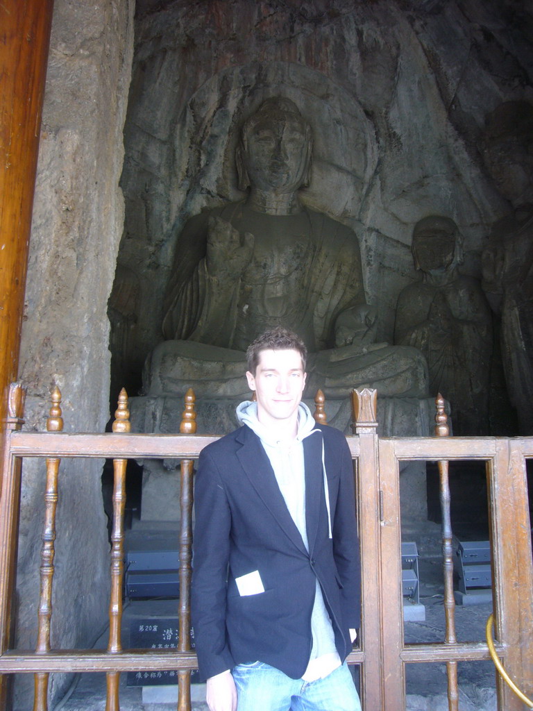 Tim with Buddha statue in the Qianxi Temple at the Longmen Grottoes
