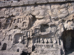 Niches with small Buddha statues at the Longmen Grottoes