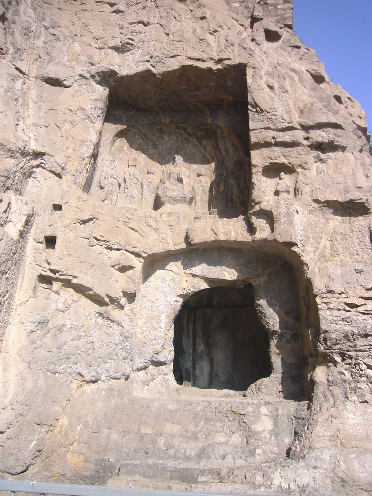 Cave and niche with Buddha statues at the Longmen Grottoes