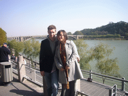 Tim and Miaomiao with the Bridge over the Yi River, viewed from the west side of the Longmen Grottoes