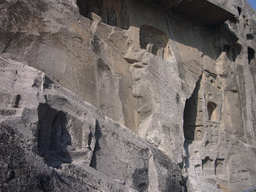 Niches and writings on the wall at the Longmen Grottoes