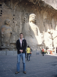 Tim with Vairocana Buddha and other statues at Fengxian Temple at the Longmen Grottoes
