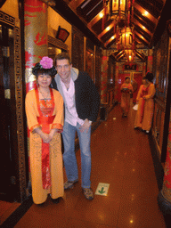 Tim with waitresses in a restaurant near Luoyang