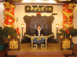 Tim on a throne in a restaurant near Luoyang