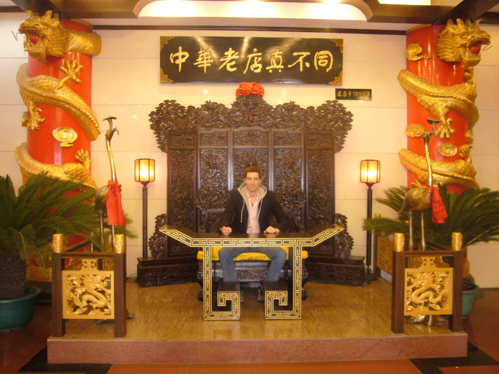 Tim on a throne in a restaurant near Luoyang