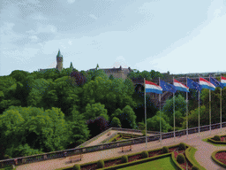 Garden with the flags of Luxembourg and the European Union, the Pont Adolphe bridge and the Building of the European Coal and Steel Community, viewed from the Boulevard Franklin Delano Roosevelt