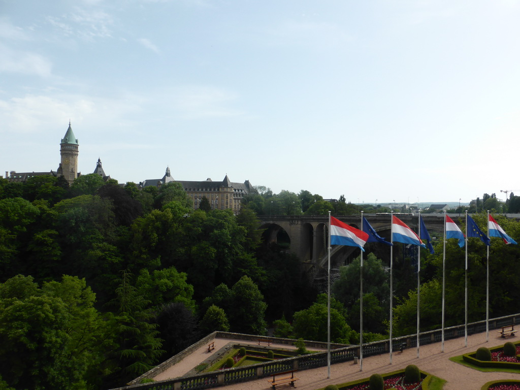 Garden with the flags of Luxembourg and the European Union, the Pont Adolphe bridge and the Building of the European Coal and Steel Community, viewed from the Boulevard Franklin Delano Roosevelt