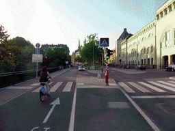 Miaomiao biking on the Boulevard Franklin Delano Roosevelt, the District Court building at the Judicial Precincts Area and the towers of the Notre-Dame Cathedral