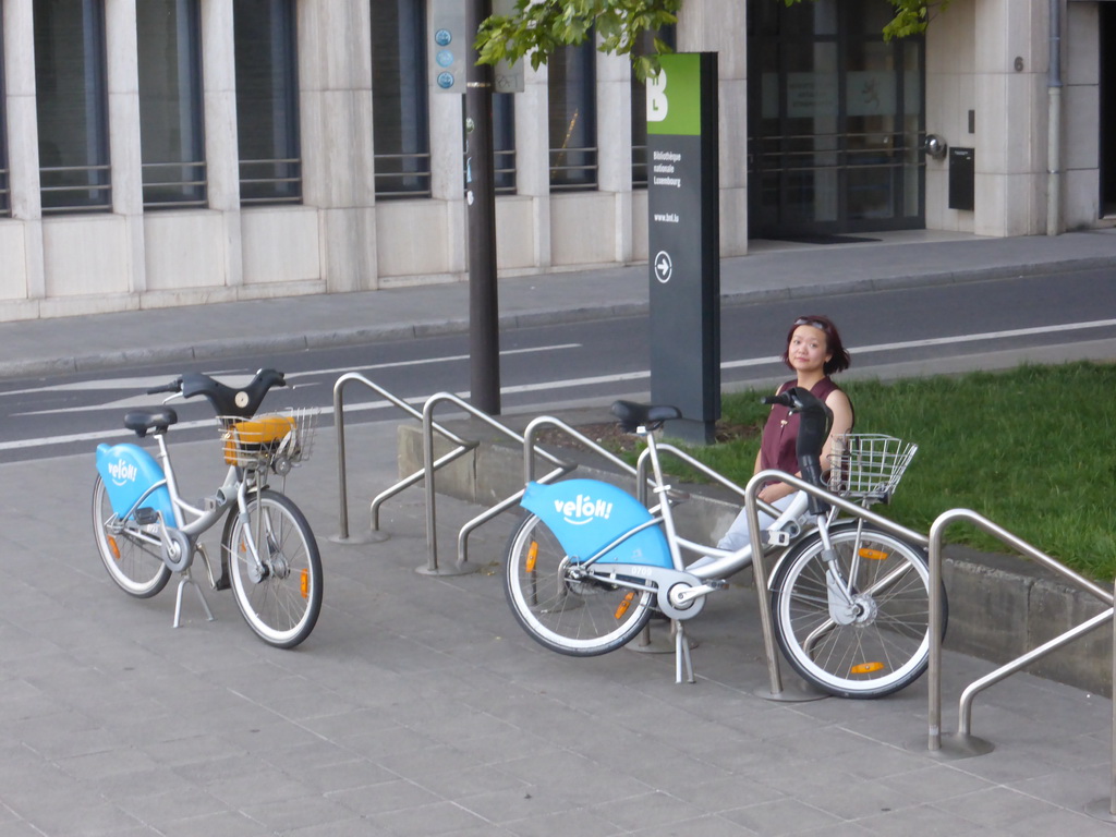 Miaomiao with our rental bikes at the Rue de l`Ancien Athénée street