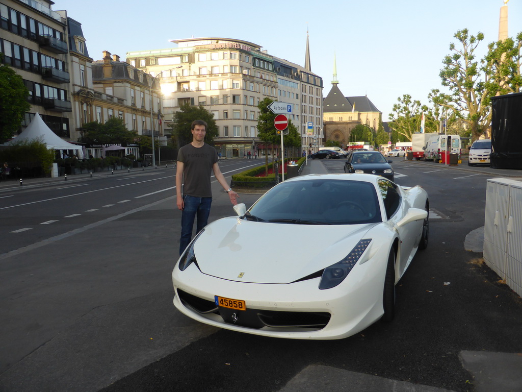 Tim with a Ferrari at the Place de la Constitution square