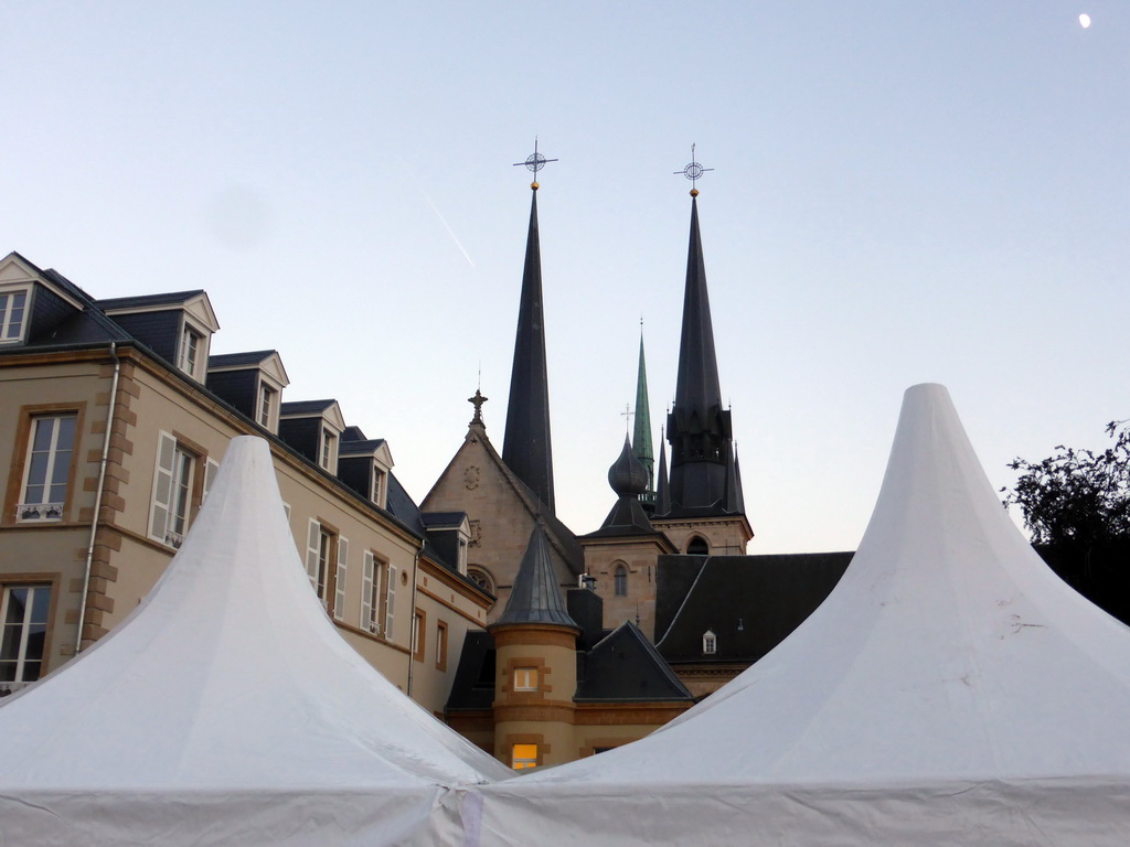 Top of a tent at the Place Guillaume II square and the towers of the Notre-Dame Cathedral