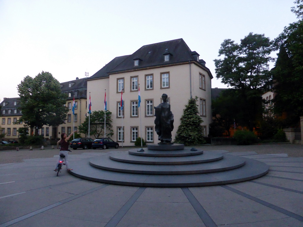 Miaomiao on her rental bike and the Grand Duchess Charlotte Monument at the Place Clairefontaine square